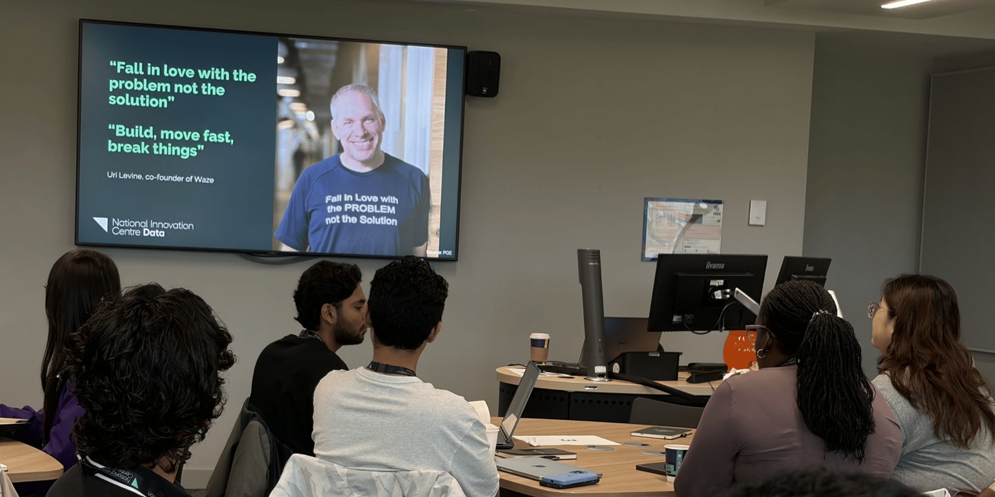 Students at the Bootcamp following a presentation on screen