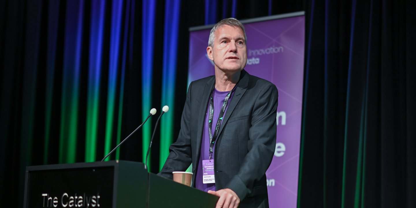 Image of Paul Watson on stage giving a talk